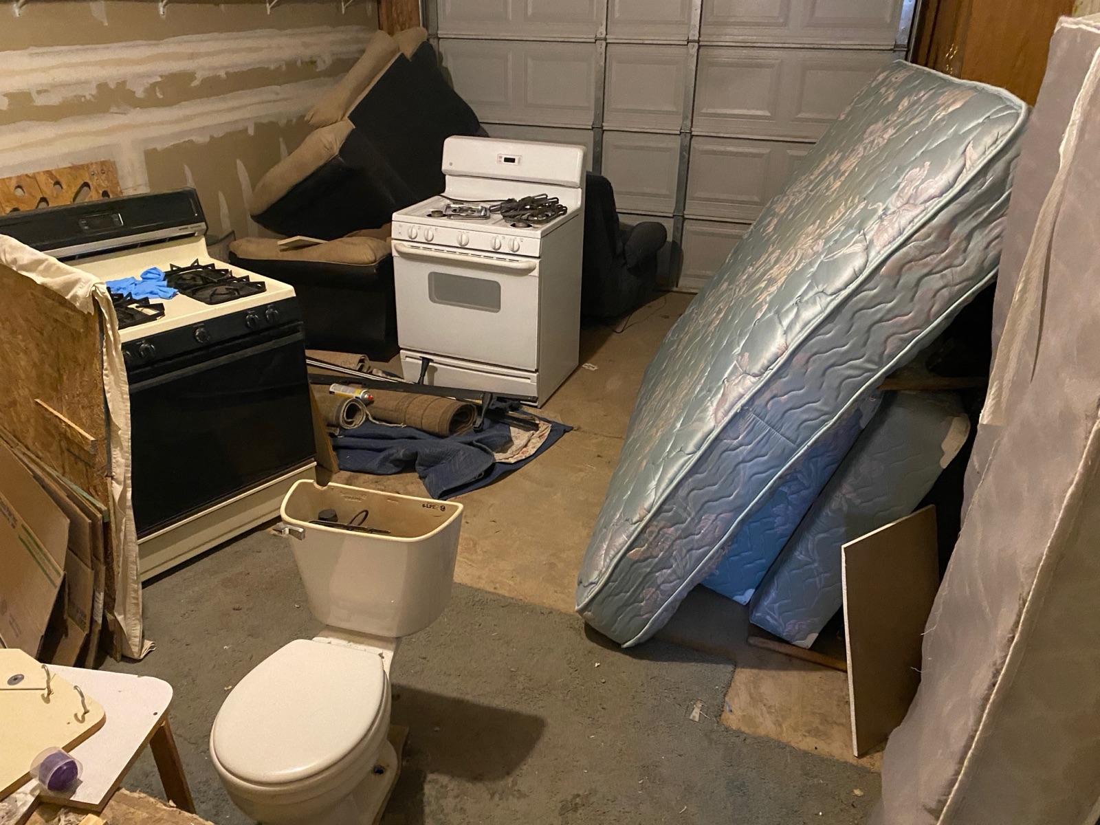 Estate cleanout with old appliances and furniture